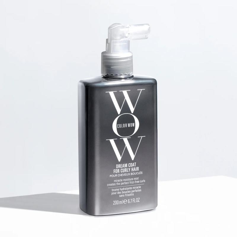 Bottle of WOW Color Wow Dream Coat for Curly Hair on a light gray background